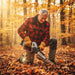 Elderly man cutting log in autumn forest with MiniSawPro M7 compact cordless pruning chainsaw